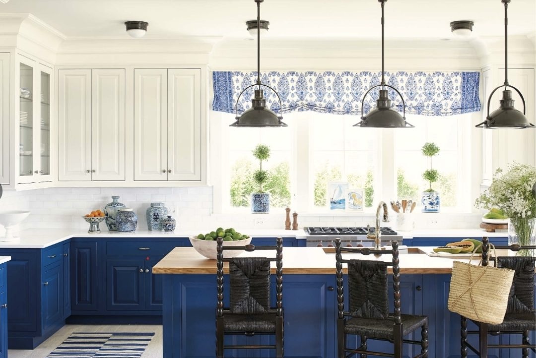  this kitchen has bright sapphire blue lower and island cabinets
