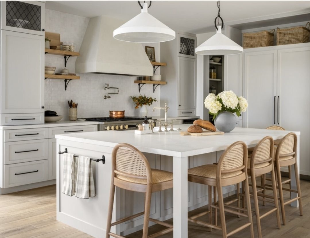 The custom European style hood is very popular right now. The curved stools soften all the straight lines.